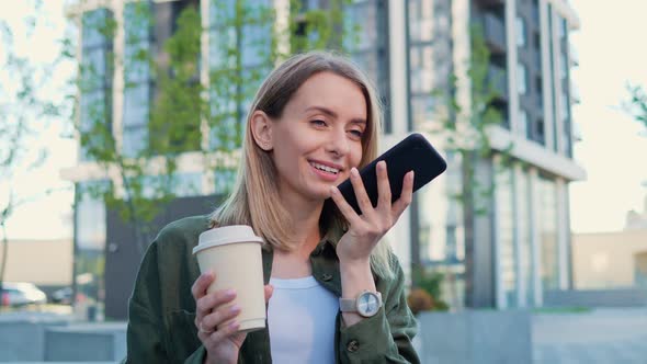 Blonde Girl Using Voice Recognition on Smartphone Voice Dialing Message