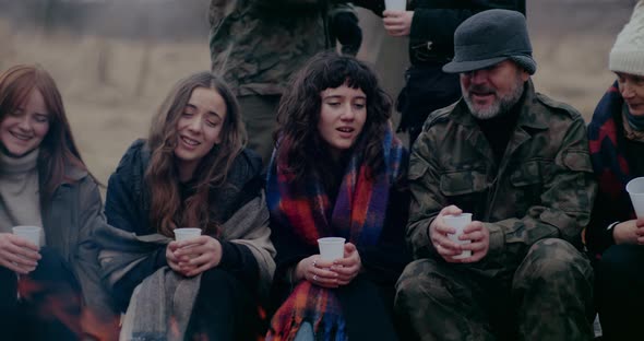 Soldier And Refugees Singing During War Crisis