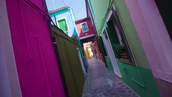 Narrow Street in Shadow Between Colorful Houses in Burano