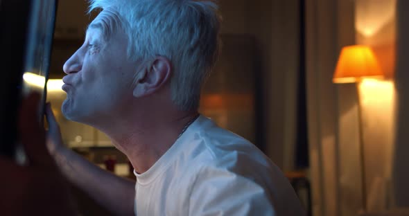 Excited Old Man Watching Football Match on Tv Late in Evening