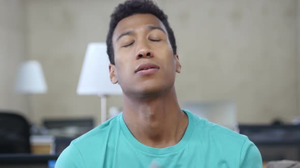 Tired Black Young Man in Office, Portrait