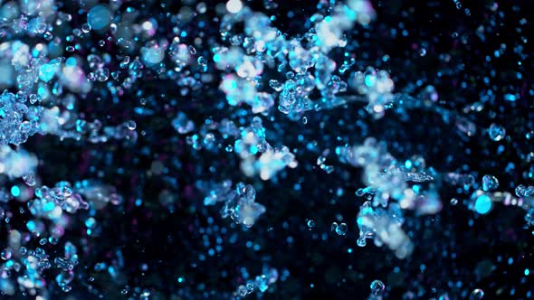 Super Slow Motion Abstract Shot of Splashing Neon Water at 1000Fps