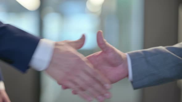 Close Up of Businessmen Shaking Hands