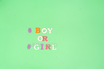 The words boy or girl are depicted in pixel art on a green background