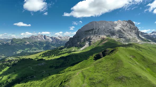 Dolomites mountains peaks with a hiking path on a summer day
