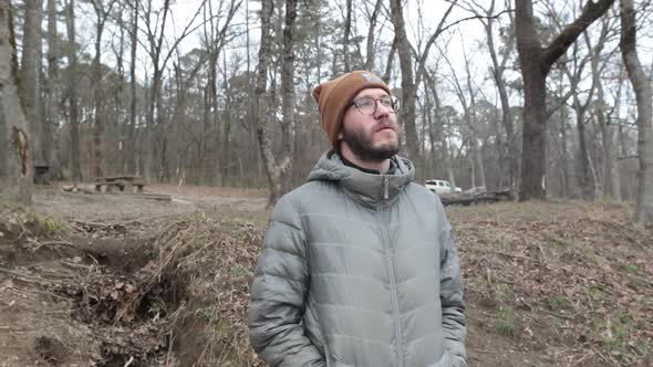 Hipster couple walks around in the forest together exploring the wilderness and nature and all the o