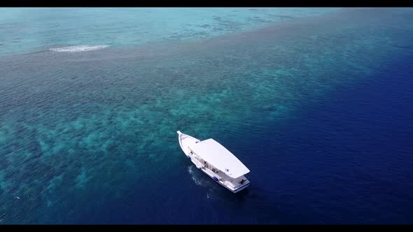 Aerial view seascape of idyllic bay beach journey by blue sea and white sandy background of a dayout