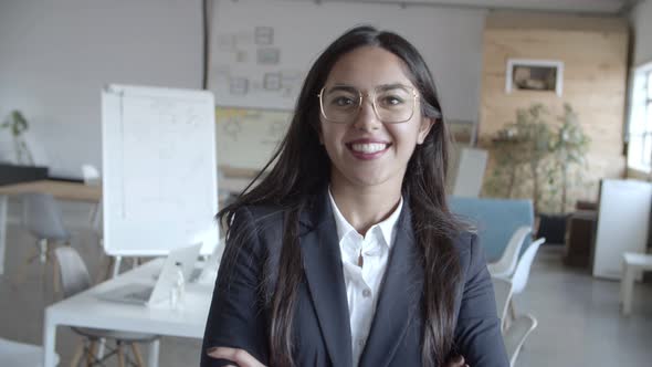 Confident Young Businesswoman Smiling at Camera