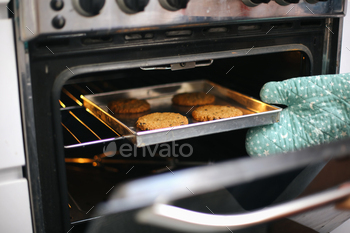 Hand Taking Cookies On Oven. Baked Cookies