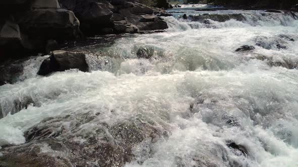 Stream of Water Between Mountain Stones