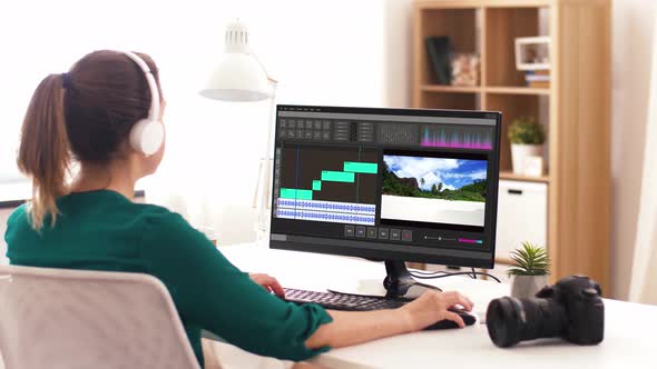 Woman with Video Editor Program on Computer