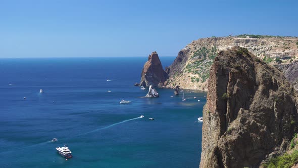 Sea Landscape with Yachts and Rocky Coastline