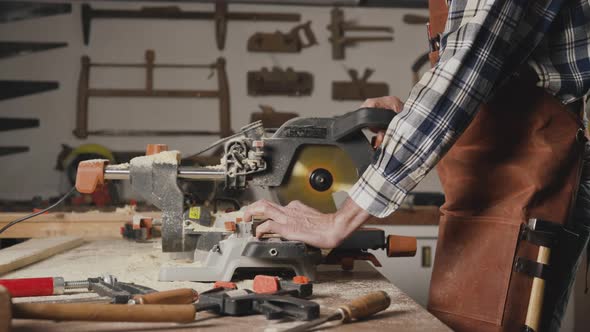 Carpenter Working At Workshop