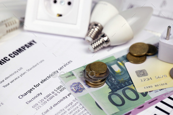 Calculator and Euro bills with pen on european electricity bill