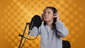 Woman with headset on starting job, narrating book word for word