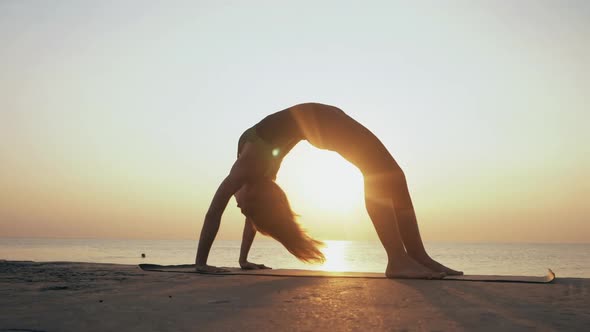 Young Woman Bodysuit Practicing Yoga Beach Above Sea Amazing Sunrise