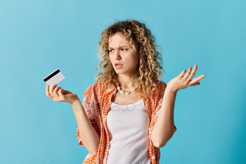 Curly-Haired Woman With Credit Card