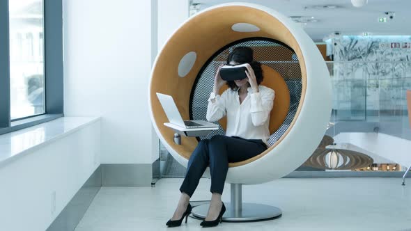 Cheerful Businesswoman in Virtual Reality Headset