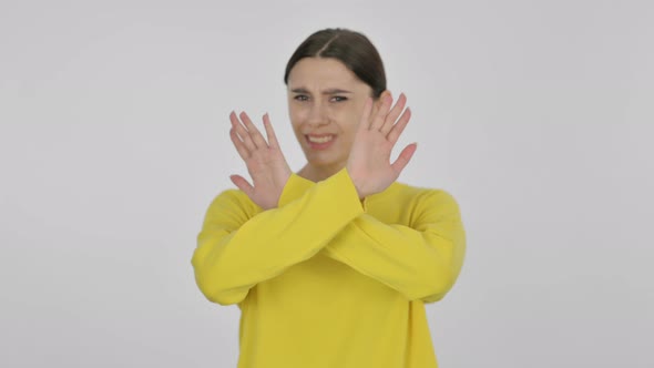 Denying Spanish Woman with Arms Crossed on White Background