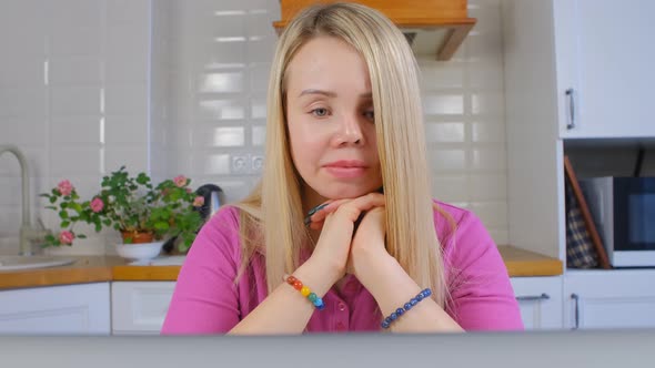 Domestic violence survivor woman in thoughts about future in front of computer