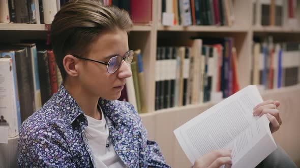 Portrait of a Young Guy Reading a Book