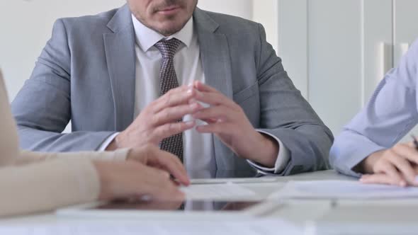 Close up of Hands of Male and Female Business Person Talking