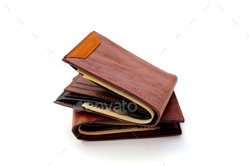 Brown wallets on white background.