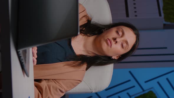 Tired Overworkes Businesswoman Sleeping in Startup Company Office on Desk Chair