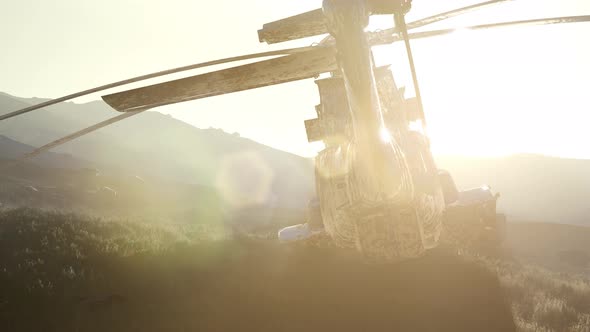 Old Rusted Military Helicopter in the Desert at Sunset