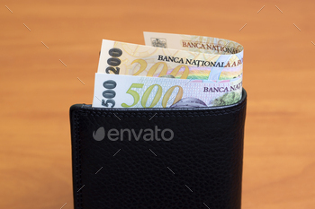 Romanian leu in the black wallet