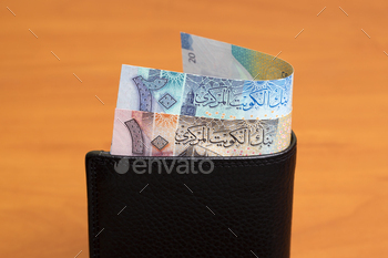 Kuwaiti  dinar in the black wallet