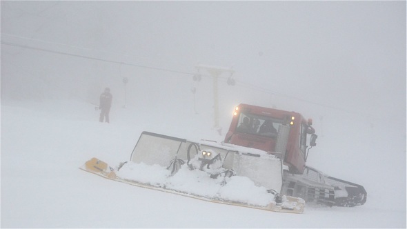 Snowcat and Skiers On Slope 2