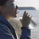 The Girl Drinks Water From a Transparent Bottle After Jogging on the Seashore - VideoHive Item for Sale