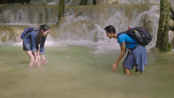 Happy Couple Playing Water Together