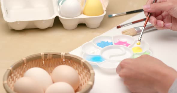 Painting on egg for Easter holiday