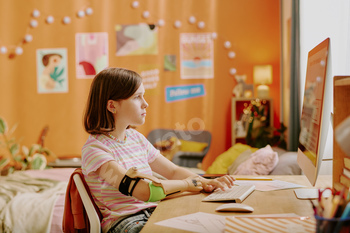 Girl With Disability Using Desktop PC