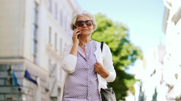 Senior Woman Calling on Smartphone in City 37