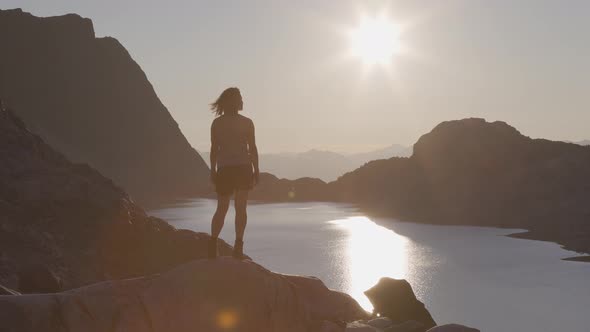 Adventurous Caucasian Adult Woman Hiking on Top of a Canadian Rocky Mountain