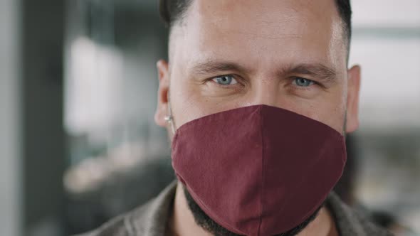 Close Up of Man in Face Mask Looking at Camera