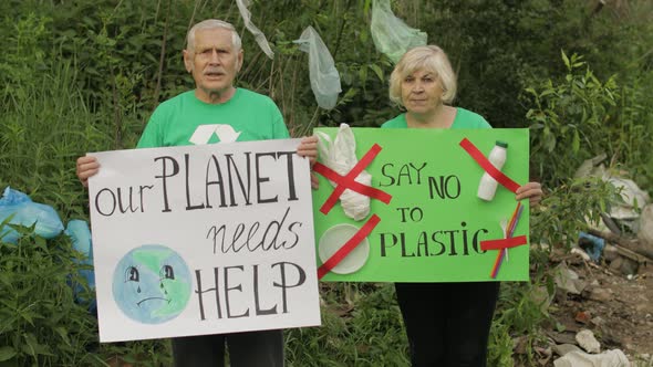 Senior Volunteers with Protesting Posters Our Planet Needs Help, Say No To Plastic. Nature Pollution