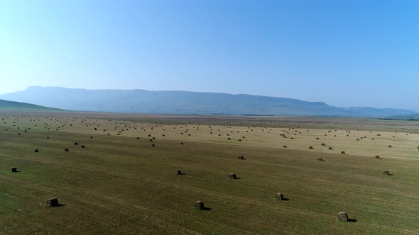 Aerial View Beautiful Landscape of a Field with Haystacks