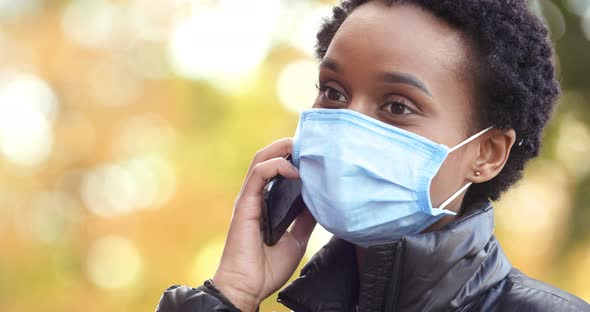 Portrait of Afro American Girl Student Wears Medical Mask Against Coronavirus Respiratory Infection