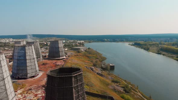 On the Banks of the River There are Large Cooling Towers for Cooling the Steam Connecting the City