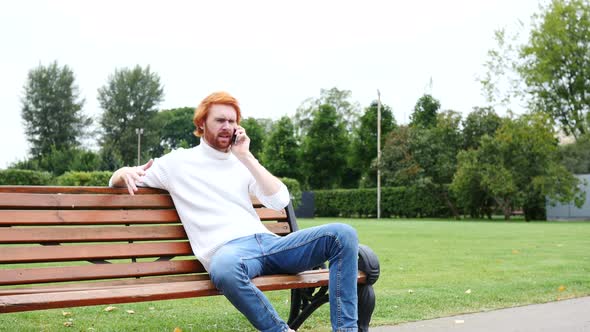 Screaming Angry Man Attending Phone Call in Park, Red Beard and Hairs