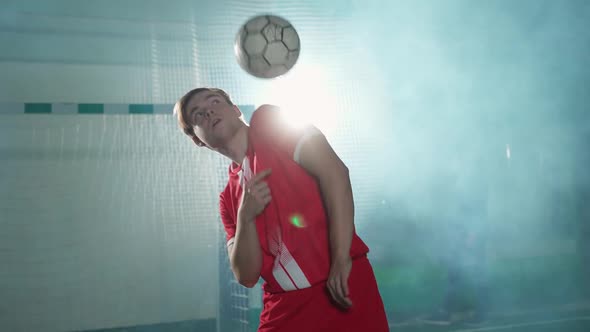 Professional Football Player Performs Tricks with a Soccer Ball Balances the Ball on Her Head