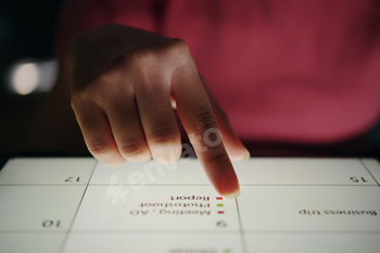 Hand Using Touchscreen Device for Business Presentation