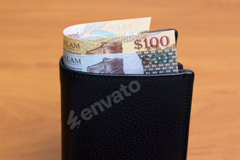 Brunei dollar in the black wallet