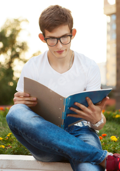 Student reading his notebook