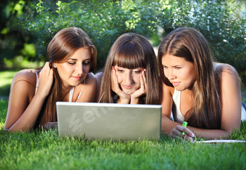 Happy young girls with notebook