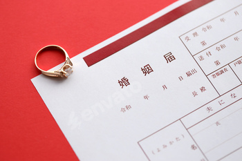 Japanese marriage registration blank document and wedding proposition ring on table